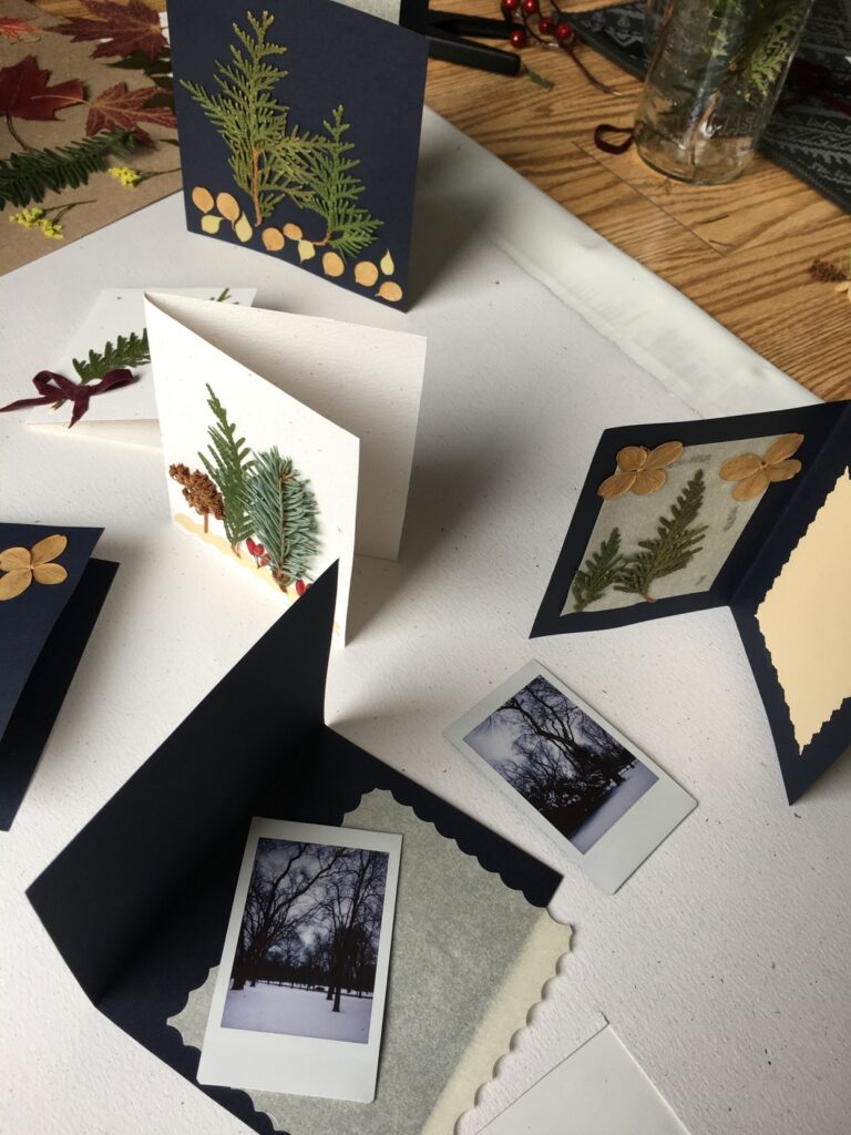 Hand made Christmas cards with dry winter leaves